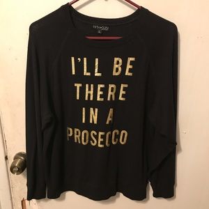 I’ll be there in a Prosecco black knit sweater